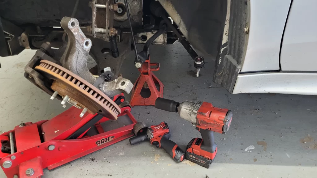 Replacing worn brake pads at Five Star Wheels and Tires