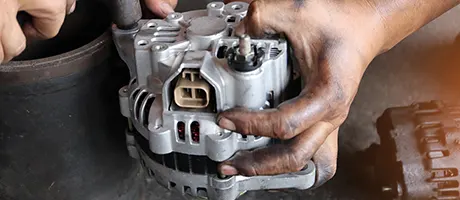 Vehicle alternator in the engine bay